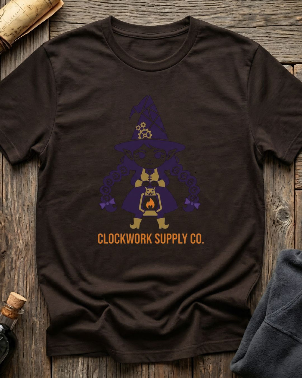 Brown t-shirt featuring the Clockwork Supply Co. design with Sprocket the gnome