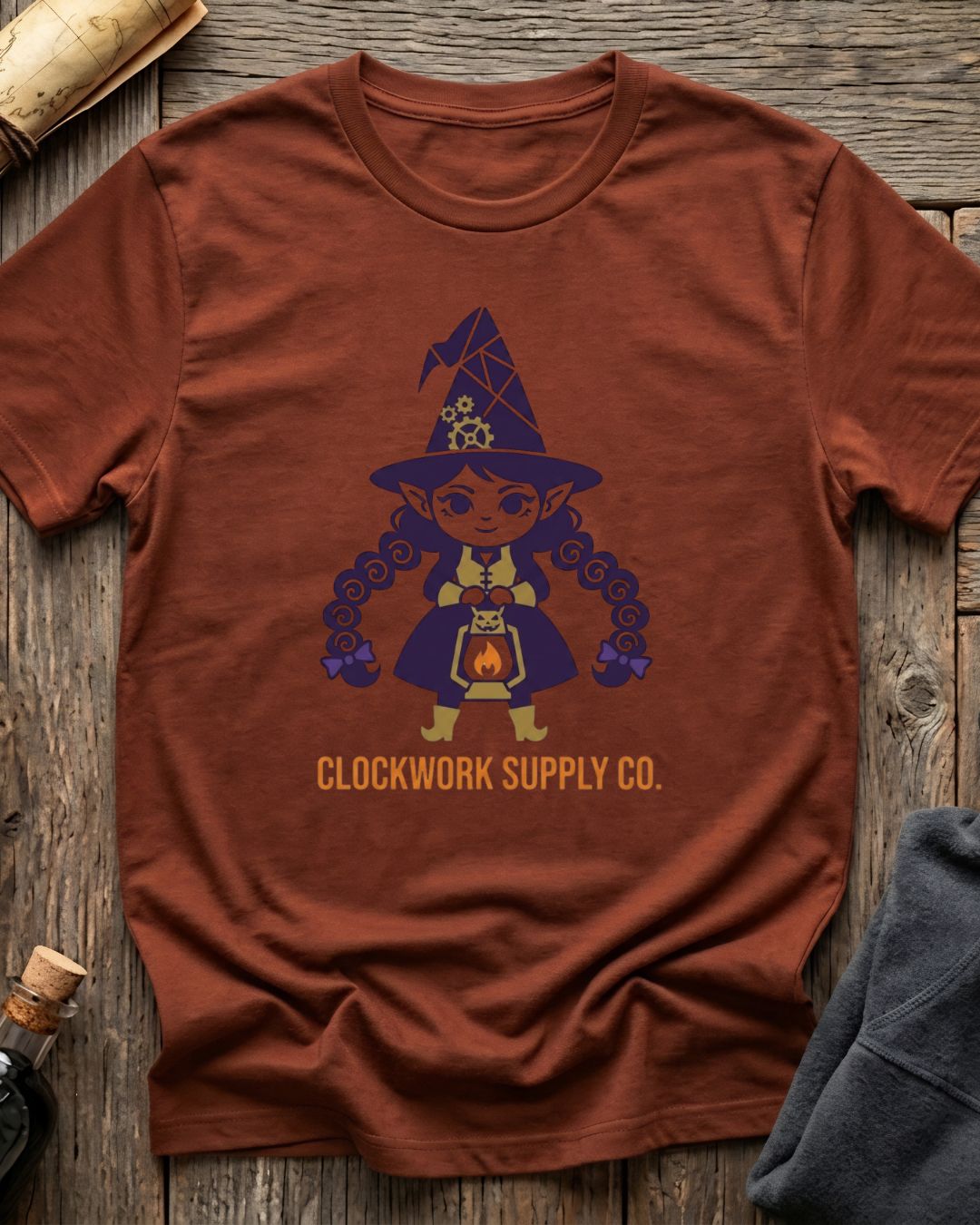 Heather Clay t-shirt featuring the Clockwork Supply Co. design with Sprocket the gnome